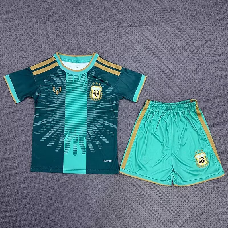 Argentina children’s dark teal and turquoise shirt with gold trim beside turquoise shorts, front view
