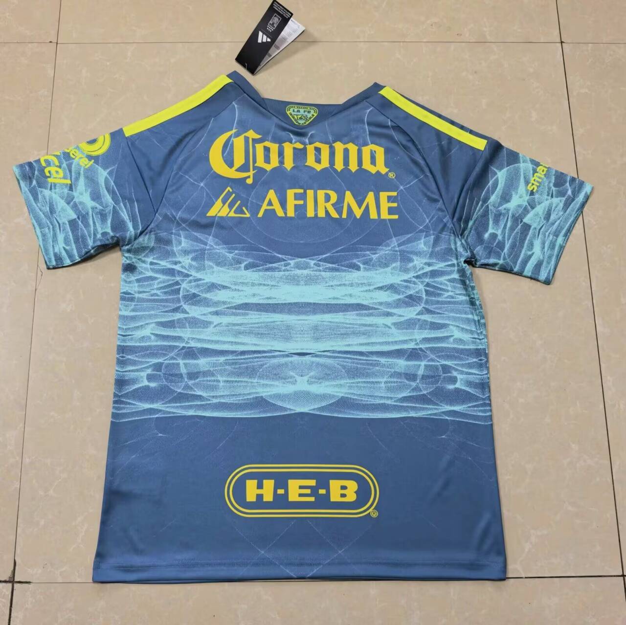 Back: aqua graphics continue below the Corona and AFIRME prints, with H-E-B lower down.